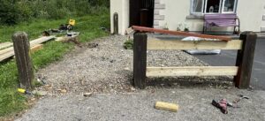 Installing new pressure-treated timber rails and fence posts during fence repair in Carlow