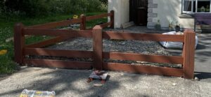 Side view of professionally restored timber fence after repair in Carlow