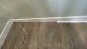 Laminate flooring expansion gap before scotia moulding installation